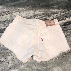 Brand new. Worn once Levi’s white shorts